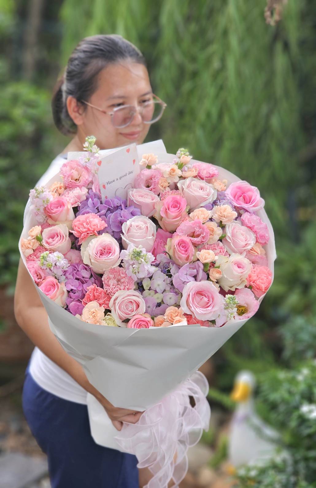 A cream and white fresh flower bouquet, arranged by hand at ChorPhaka Florist